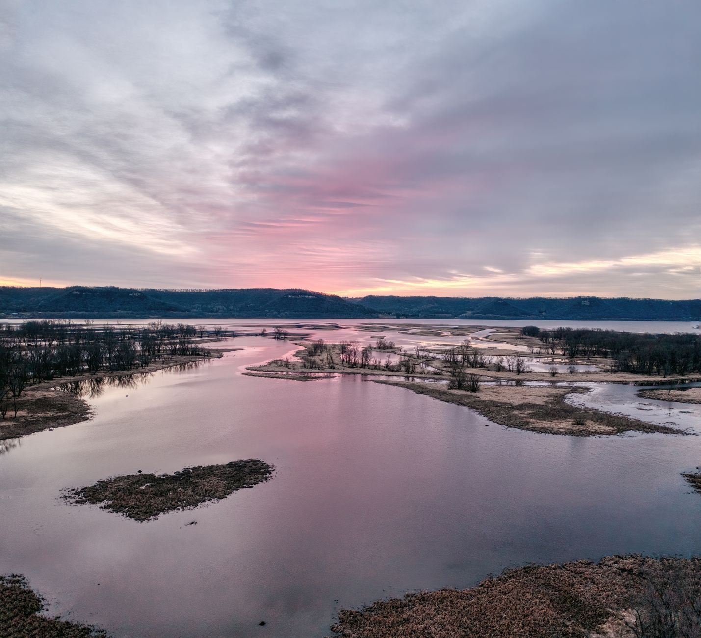 A breathtaking winter sunset over the prairie along the Mississippi River in West Newton, Minnesota