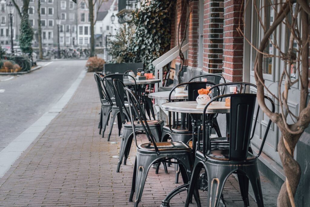 A bustling downtown café offering fresh pastries and coffee with a view of the harbor