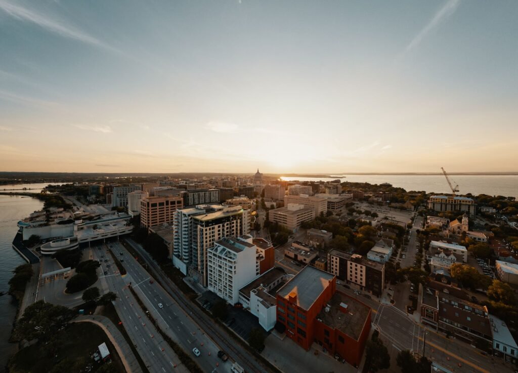 A bustling downtown street framed by historic brick buildings, perfect for a leisurely stroll