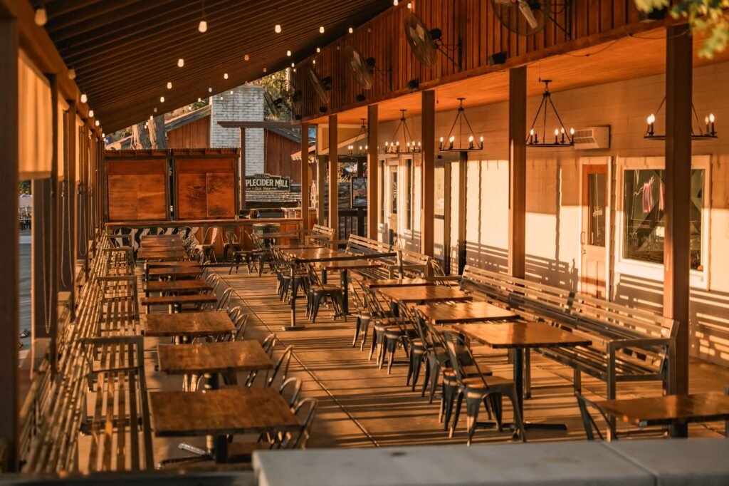 A cozy patio at a Watertown restaurant overlooking the river, perfect for an evening meal