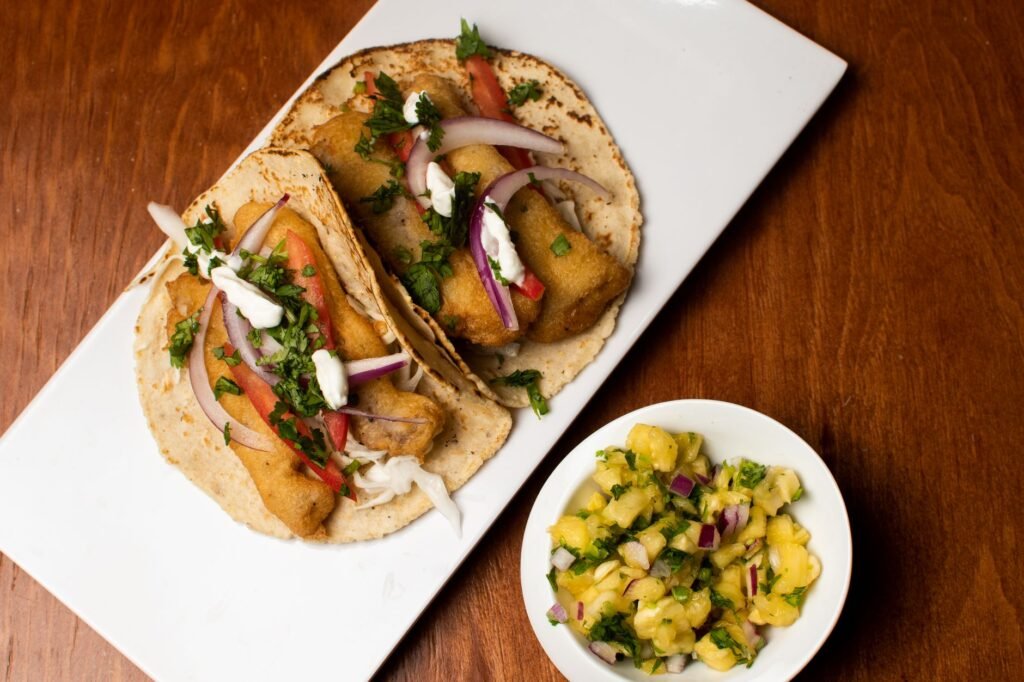 A plate of crisp fish tacos with fresh cabbage slaw, a must‑try dish in San Jose del Cabo