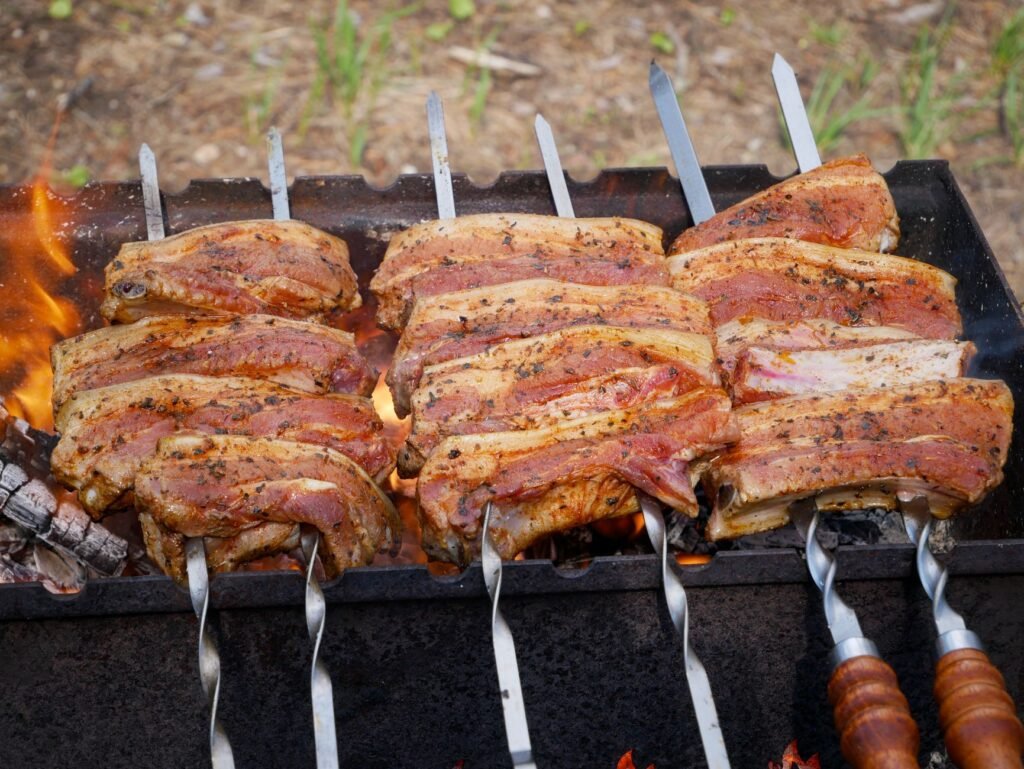 A plate of smoky barbecue ribs served with classic Southern sides