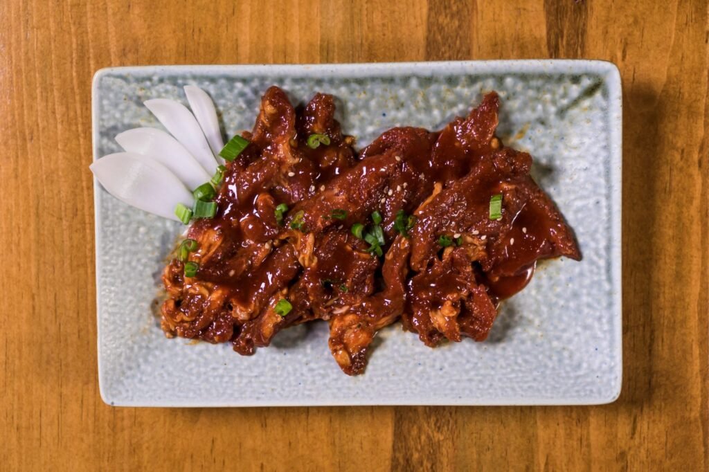 A plate of smoky Texas barbecue ribs and sides, a must‑try when visiting Seguin
