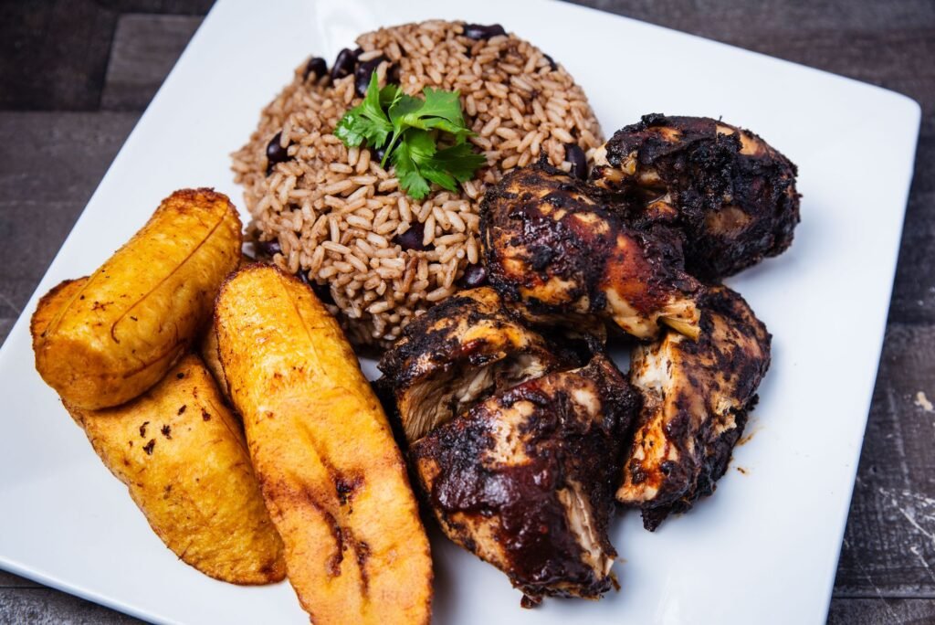 A sizzling plate of authentic Jamaican jerk chicken in a Kingston eatery