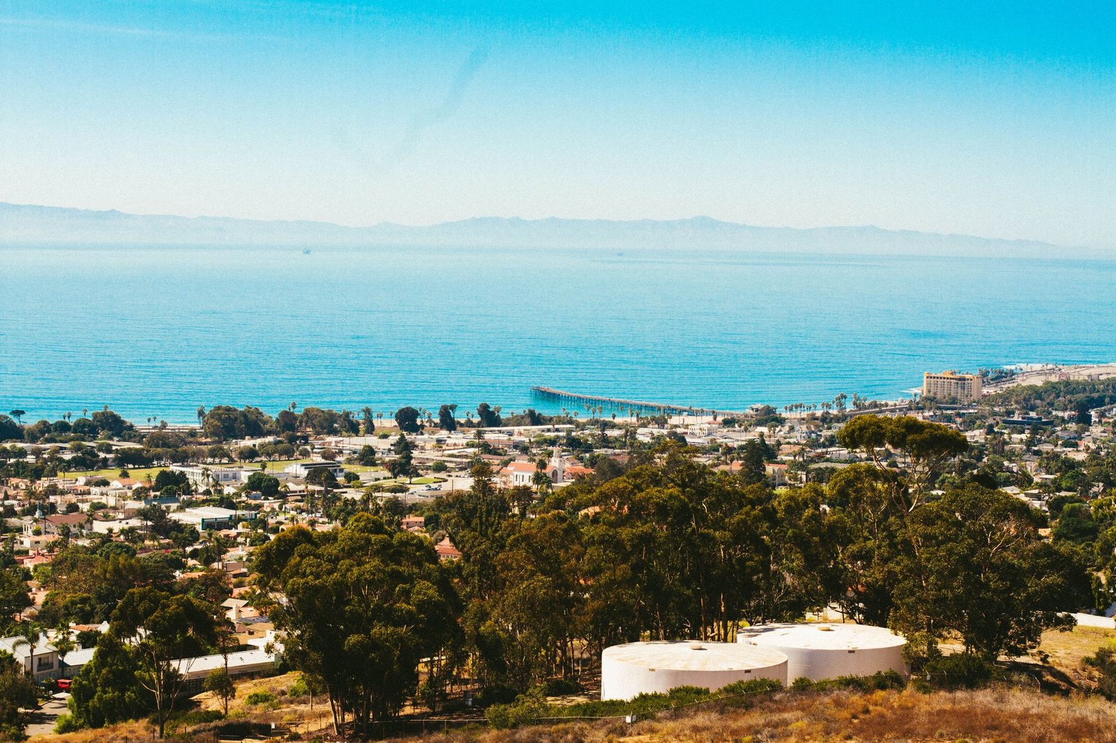 A stunning aerial view of Ventura, California capturing the coastal town and ocean on a sunny day