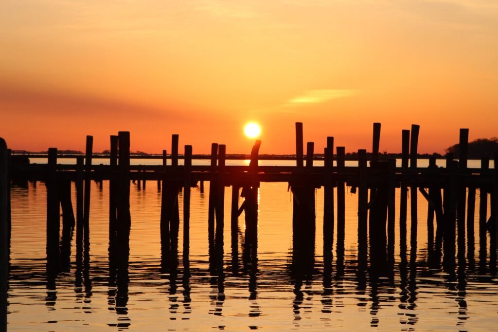 A sunrise over Seabrook's historic pier, perfect for early‑morning photography