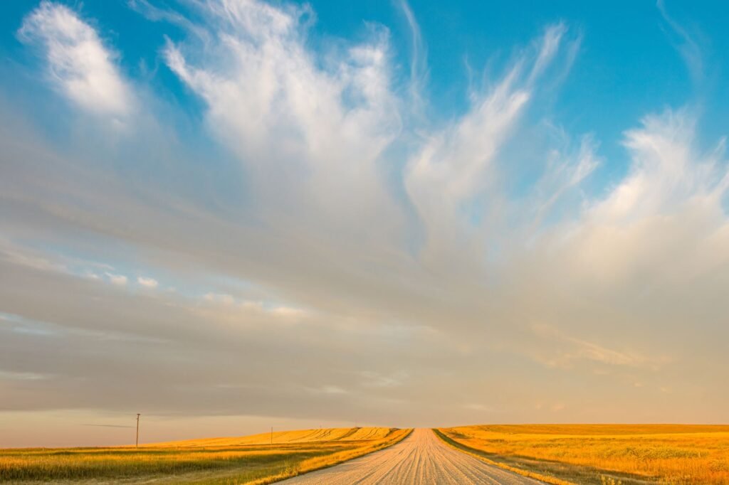 A wide‑open prairie at sunset offers a perfect backdrop for photos of Monowi’s landscape