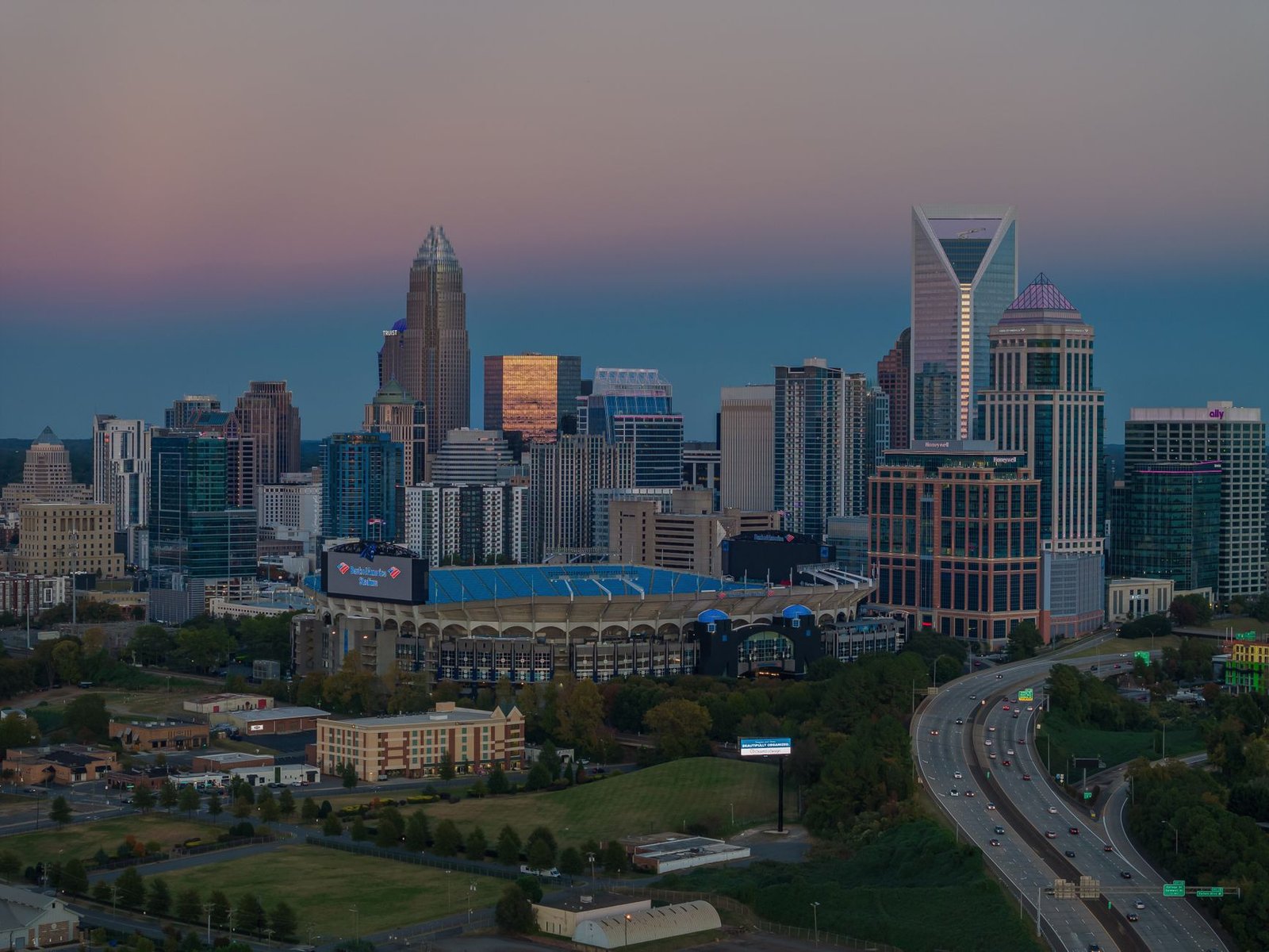 Aerial view of Charlotte skyline and Bank of America Stadium at dusk, North Carolina, USA