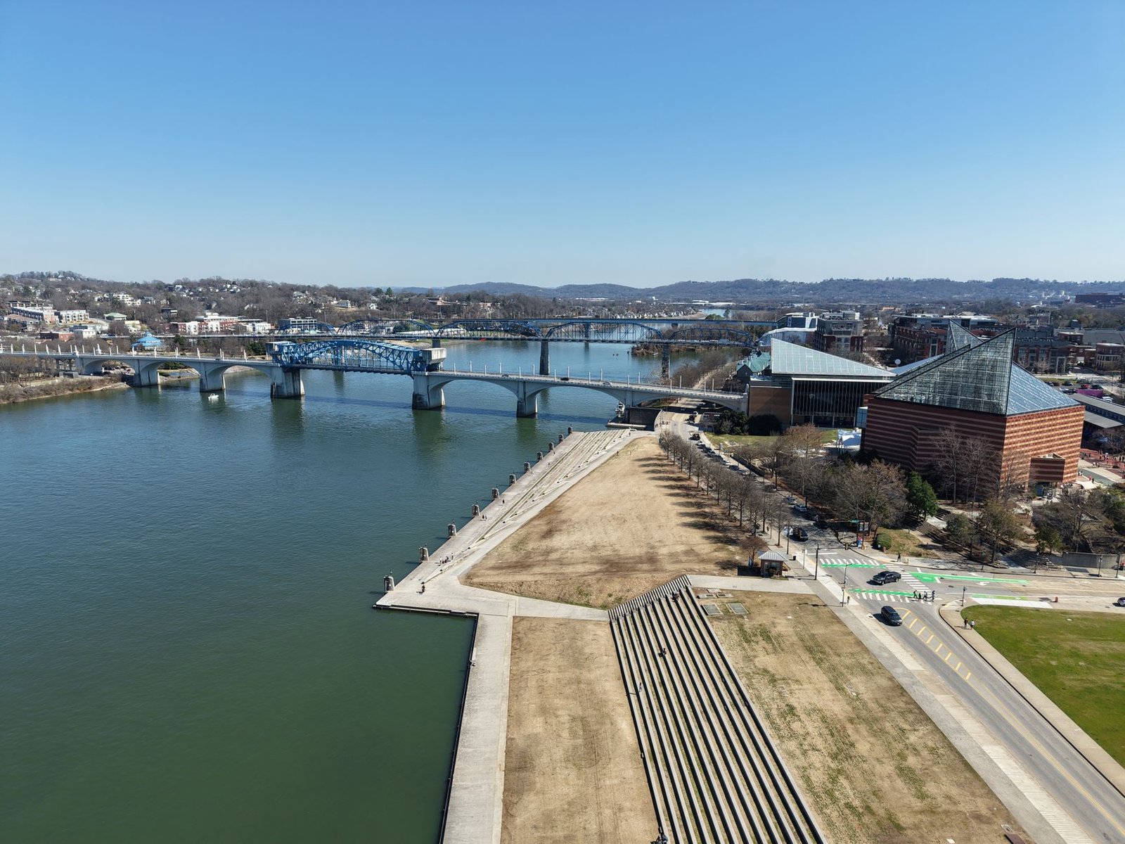 Aerial view of Chattanooga featuring the Walnut Street Bridge and Tennessee River on a clear day