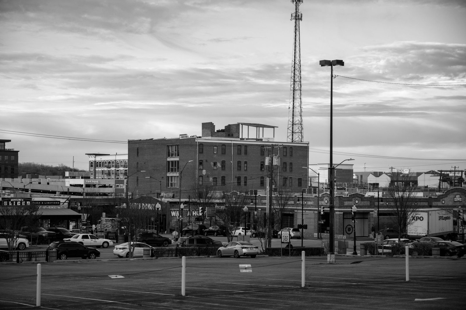 Black and white view of an urban cityscape in Tulsa, Oklahoma featuring buildings and parking lots