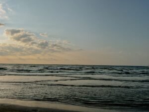 Calm ocean waves during sunrise at a beach