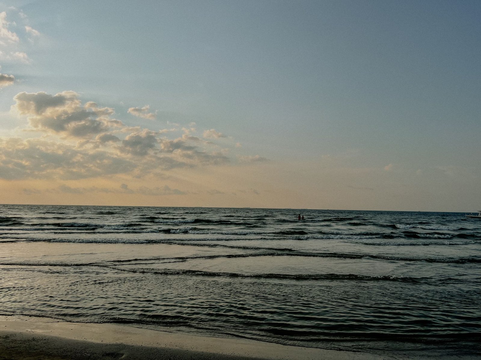 Calm ocean waves during sunrise at a beach