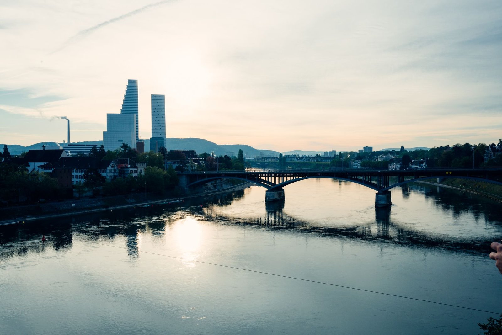Captivating view of Basel's skyline and the Rhine River at sunset