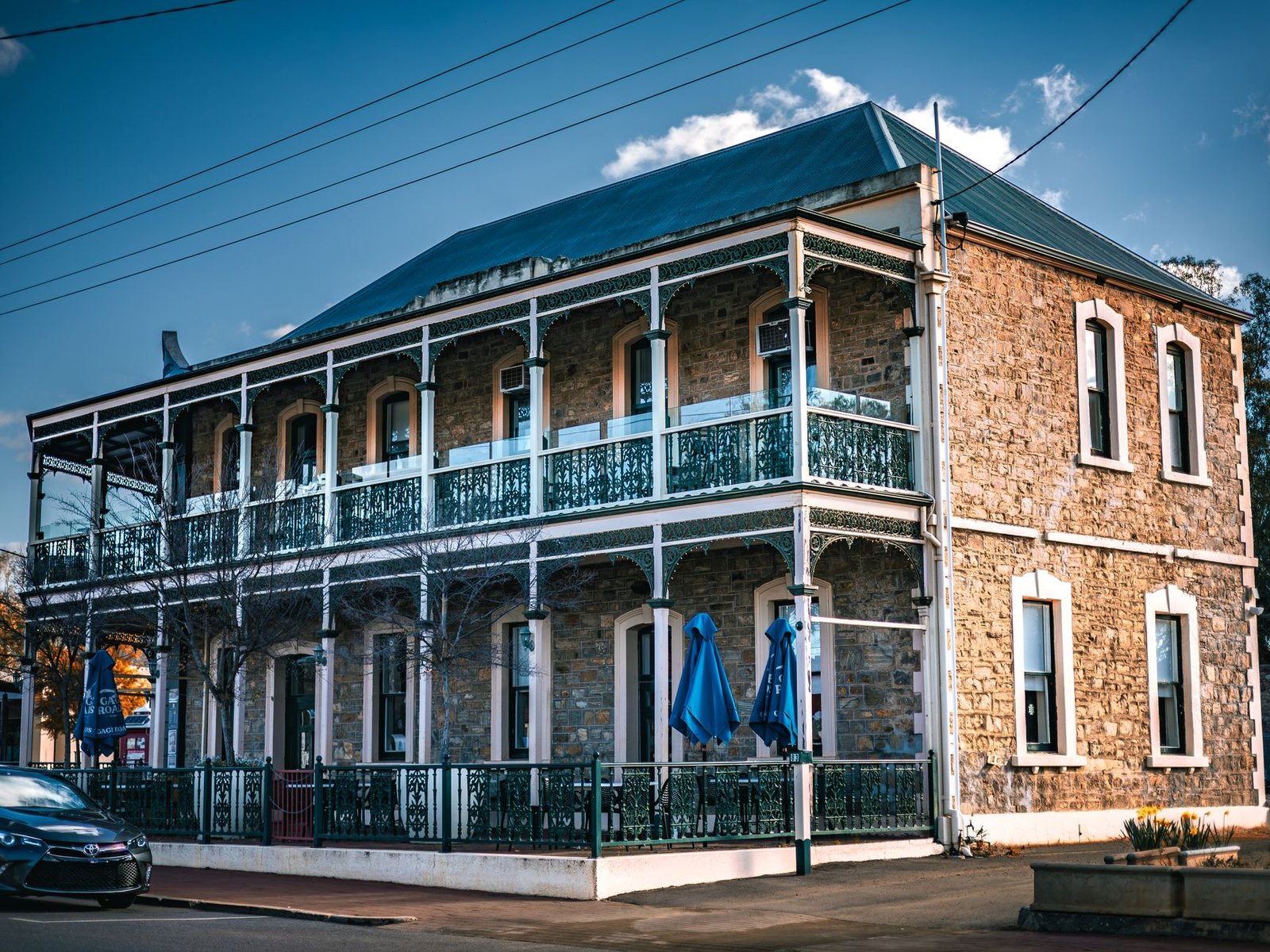 Charming historic two-story stone building with ornate ironwork in York, Western Australia