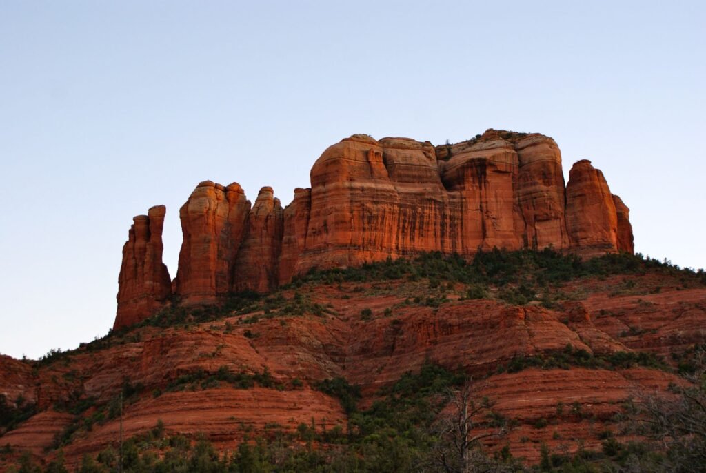 Couple enjoying a sunset dinner on a patio overlooking the red rock formations