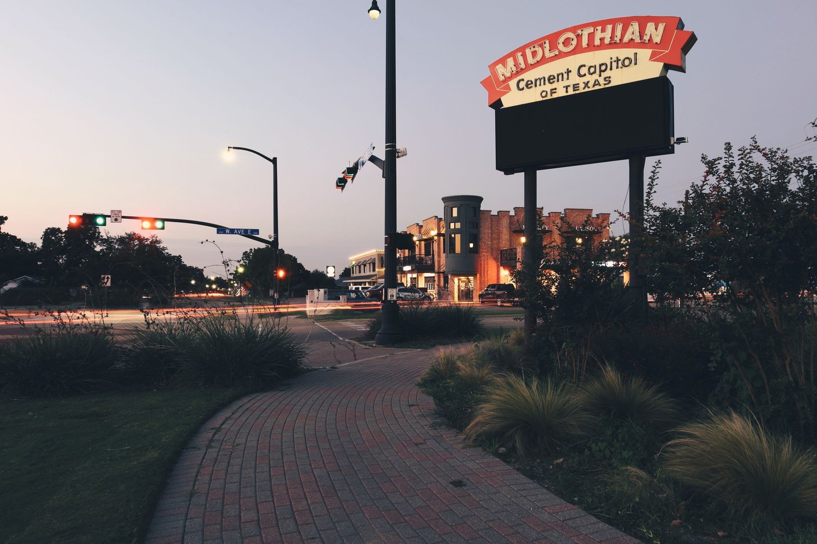 Downtown Midlothian, Texas at dusk showcasing signage and urban architecture