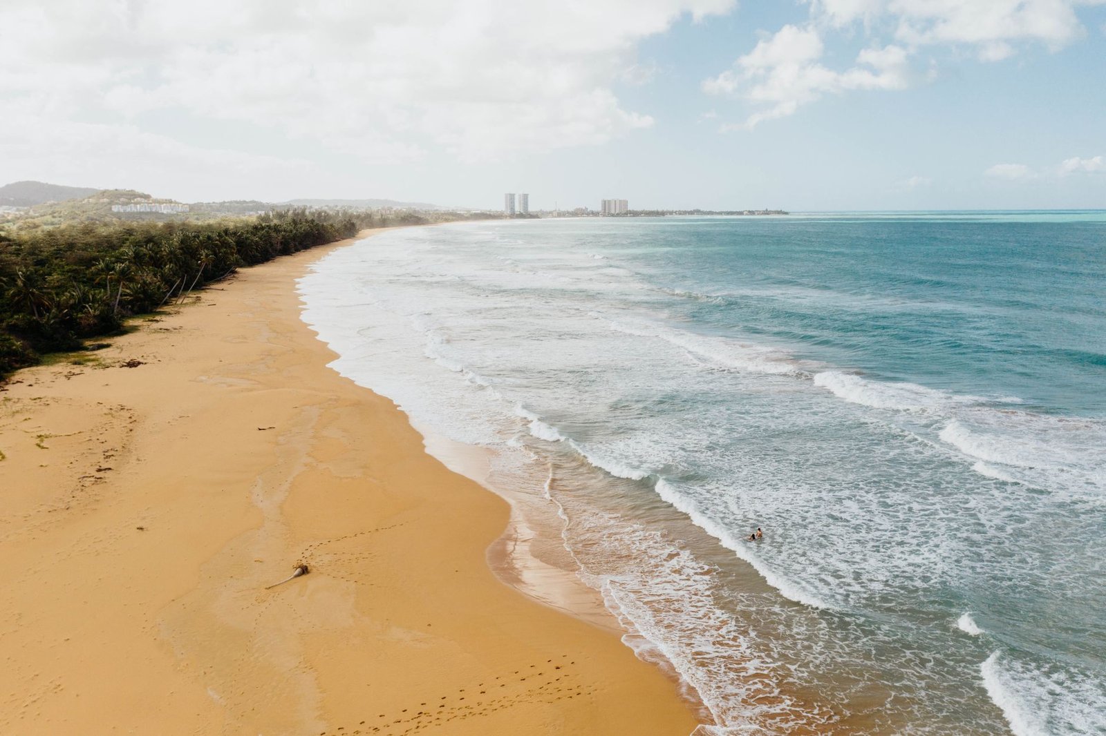 Golden sand beach in Puerto Rico with gentle waves