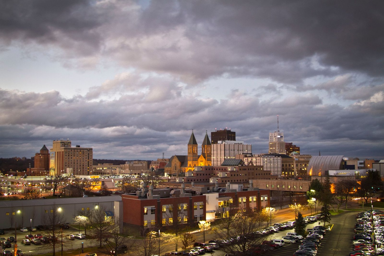 Moody view of downtown Akron, Ohio with an overcast sky during evening