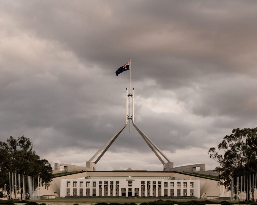 Parliament House illuminated at dusk, a centerpiece of Canberra's civic architecture