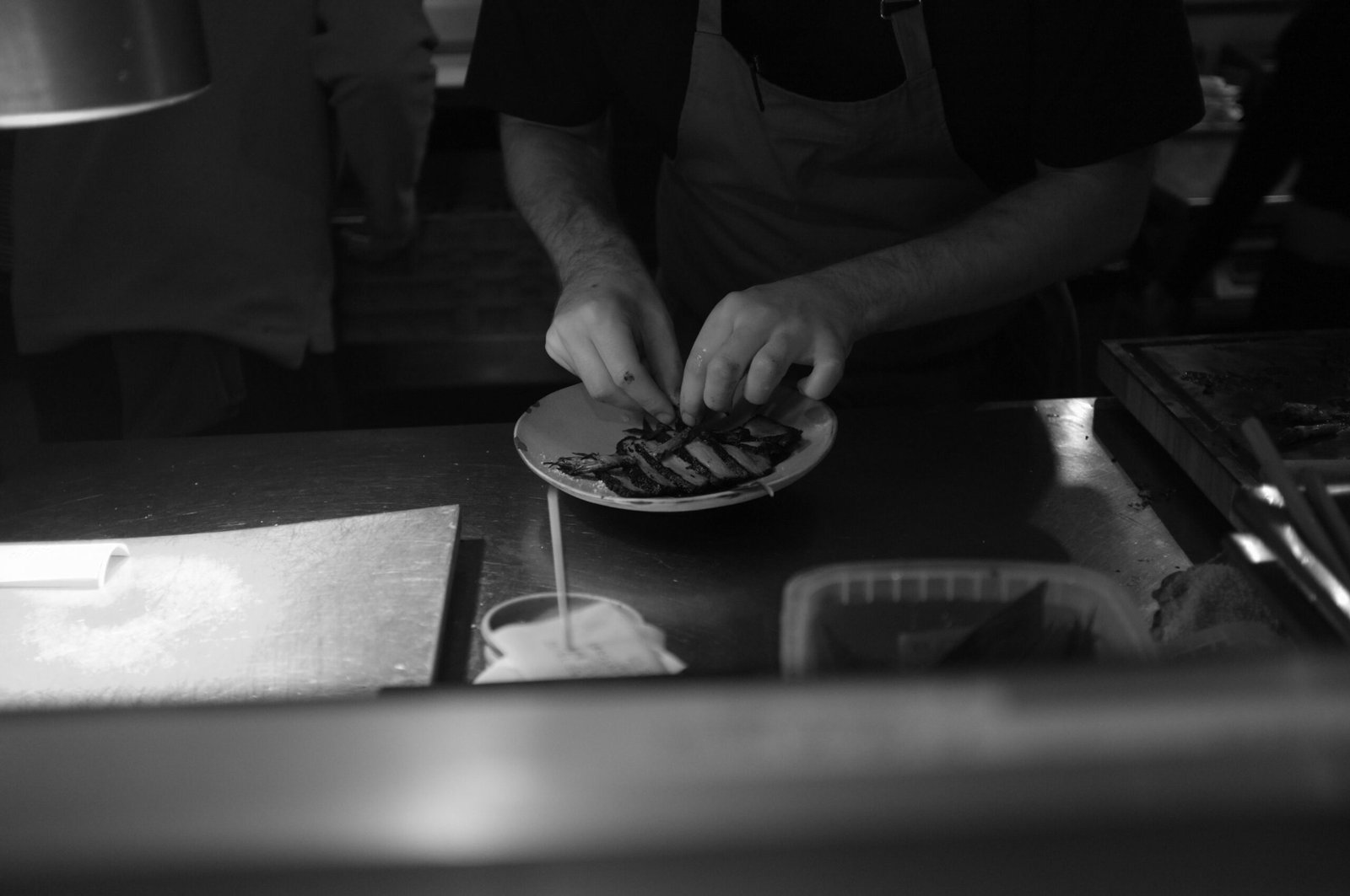 Visit The Firehouse in Denver, where chefs cook exceptional meals in an open kitchen for a unique dining experience.