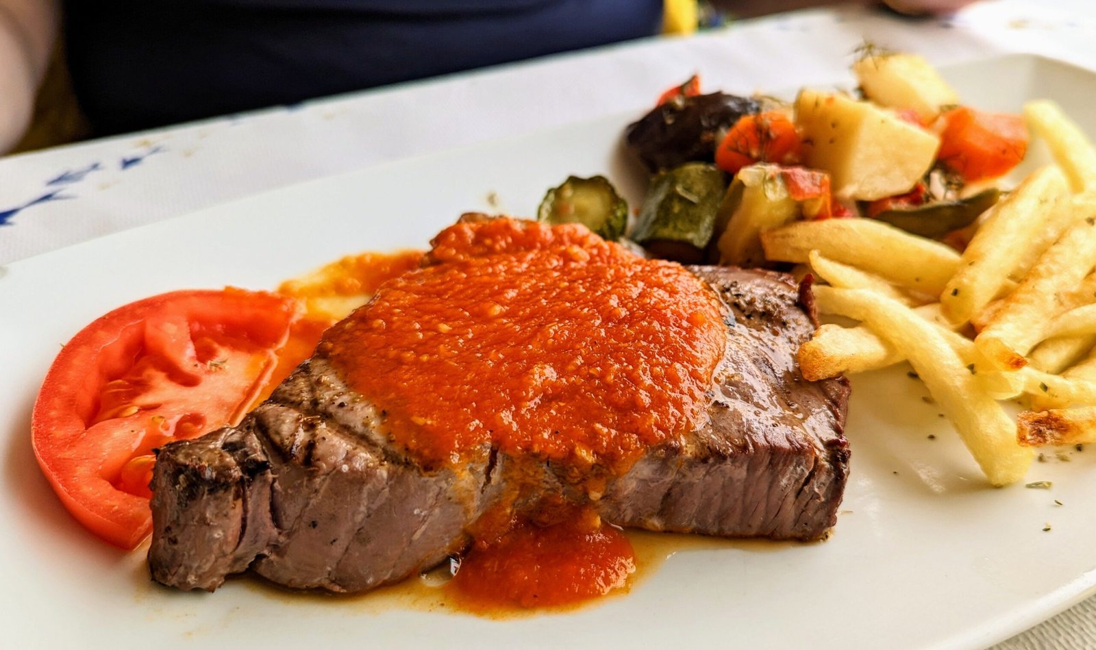 Savor traditional Greek flavors at Kiki's Tavern near Agios Sostis Beach. Savor traditional Greek flavors at Kiki's Tavern near Agios Sostis Beach.