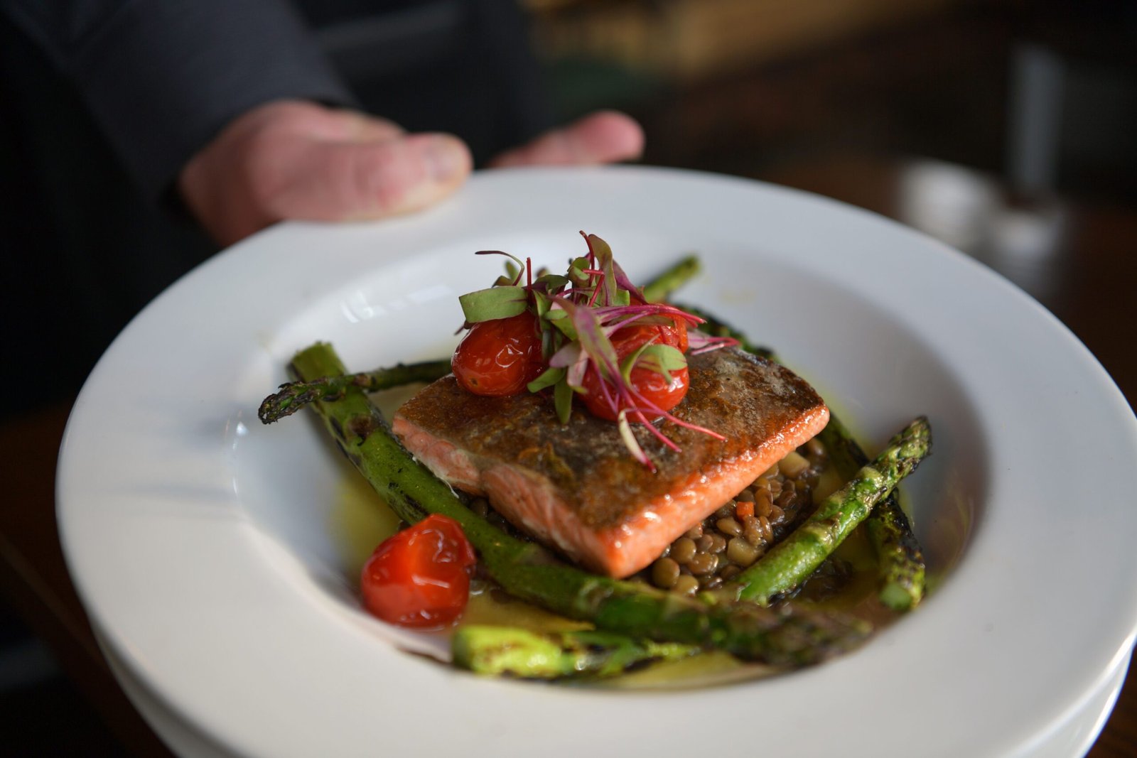 Dining at **Chef Sam's** for locally sourced seafood dishes.