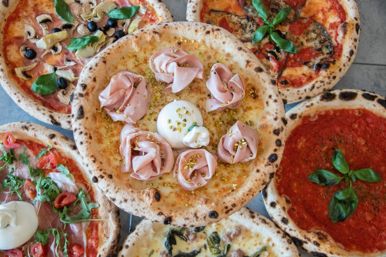 Indulge in authentic Neapolitan pizza at **Pizzeria Da Michele**.