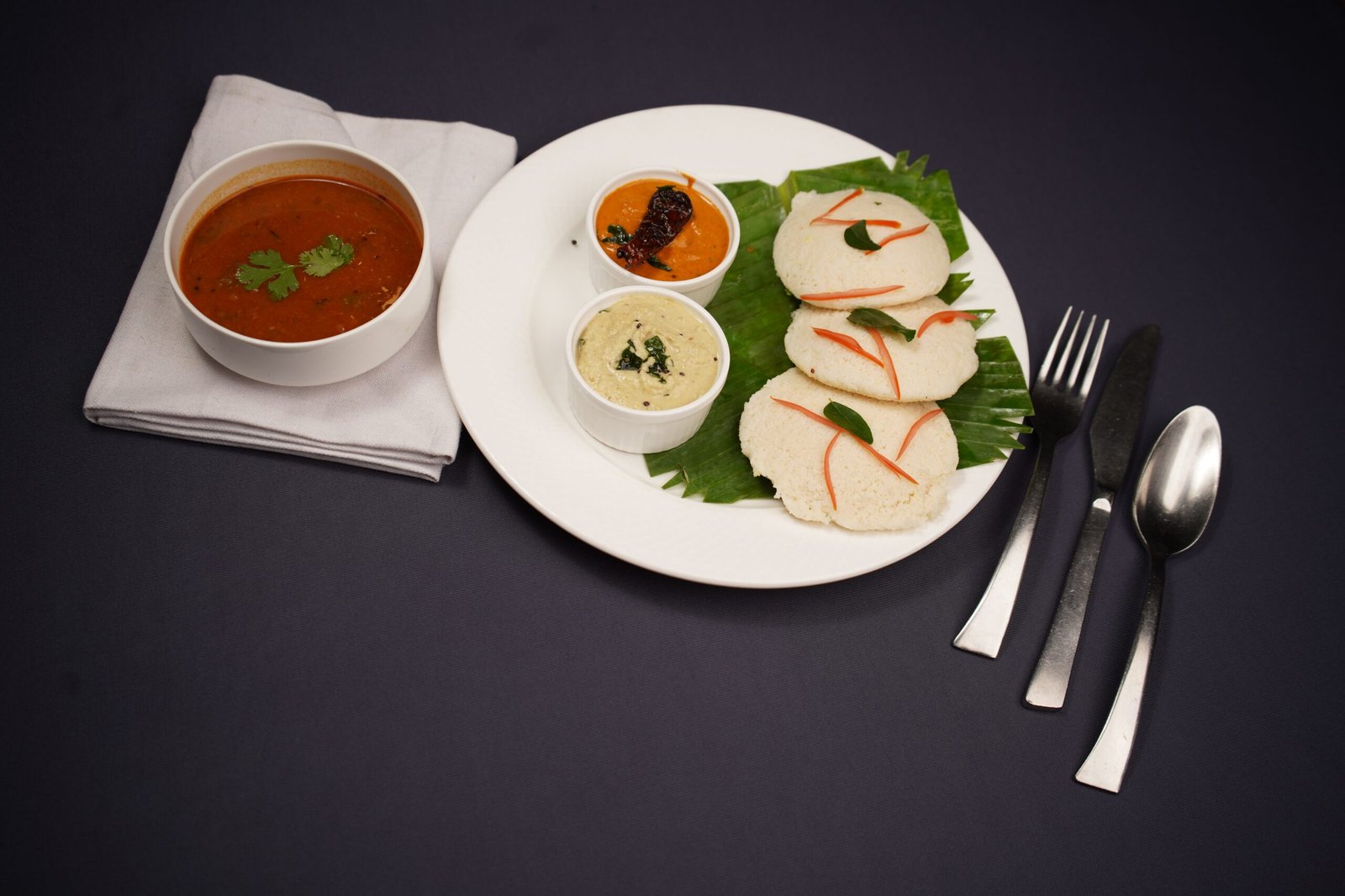 Murugan Idli Shop - Enjoy soft, fluffy idlis paired with an array of chutneys and sambar.
