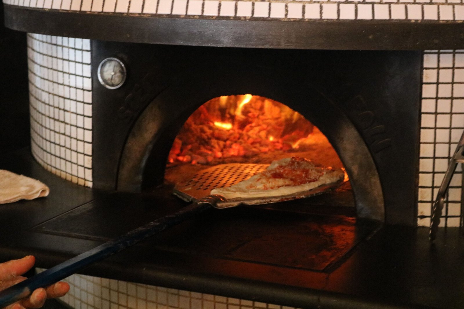 Taste authentic Italian dishes at **Il Pizzaiolo**, renowned for its wood-fired pizzas.