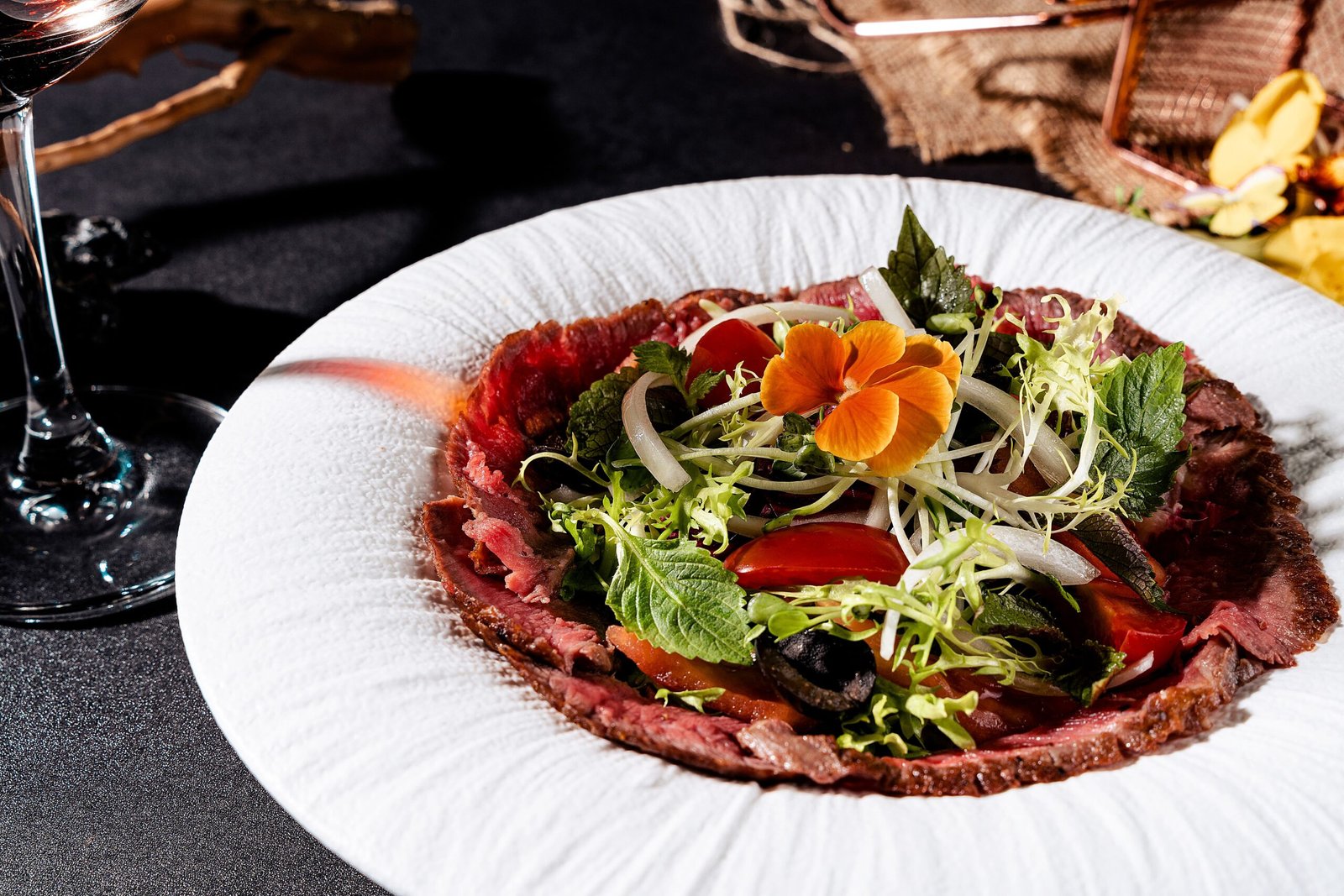 Experience a culinary journey at Le Coq au Vin, known for its exquisite French cuisine.