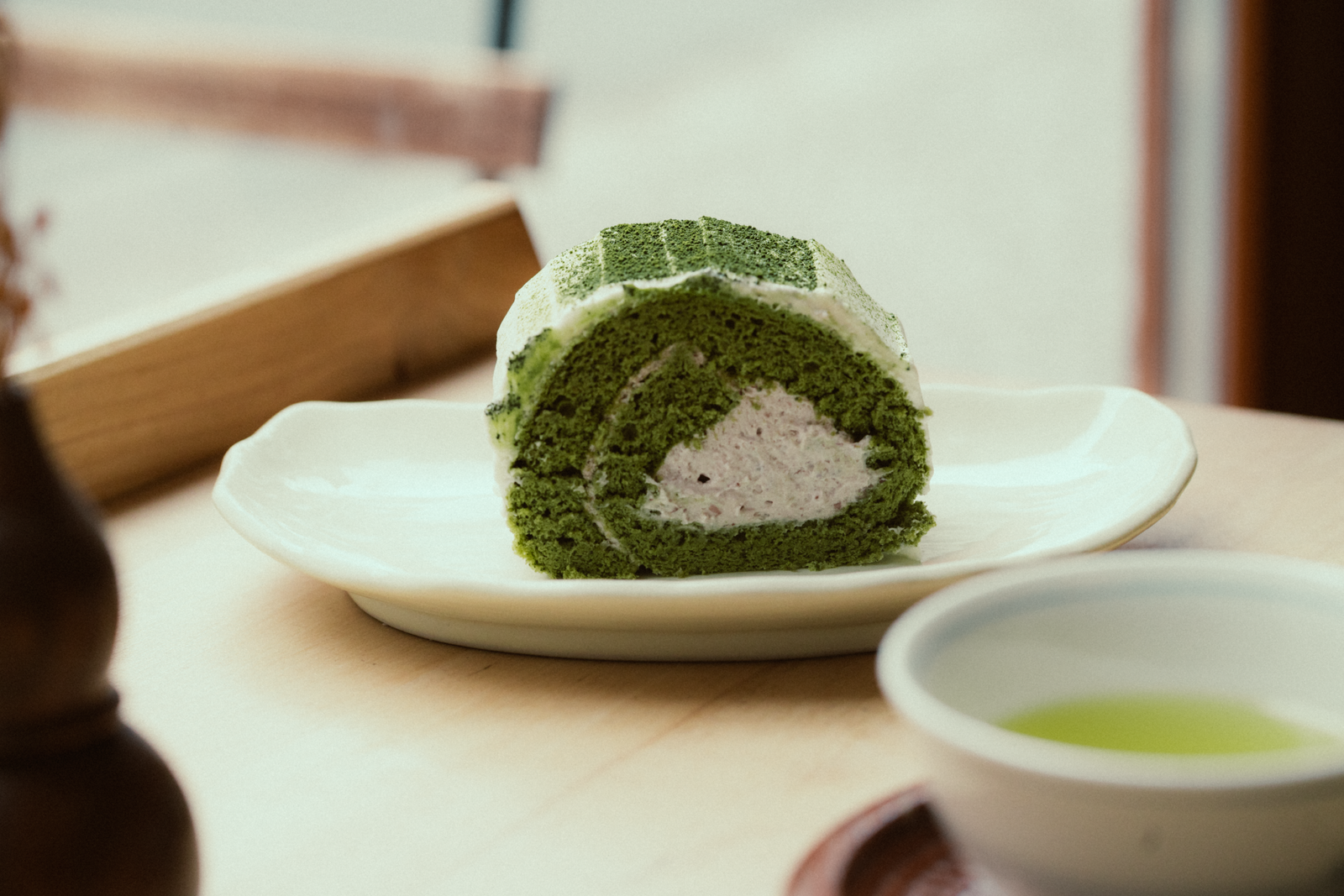 Indulge in matcha-flavored desserts at Tsujiri, a renowned tea shop in Gion. Indulge in matcha-flavored desserts at Tsujiri, a renowned tea shop in Gion.