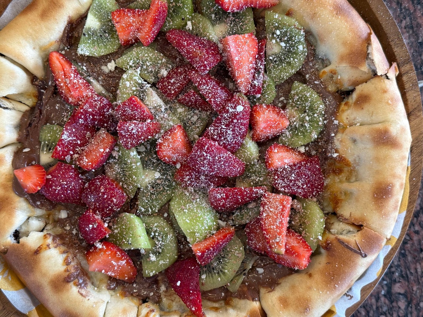 Indulge in artisanal pizza at **Blue Dust**, with its stunning river views.