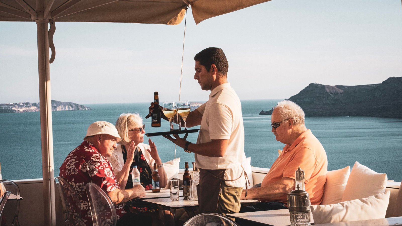 Sample locally produced wine at **Santorini Wine Adventure** paired with a Mediterranean meal. Sample locally produced wine at **Santorini Wine Adventure** paired with a Mediterranean meal.