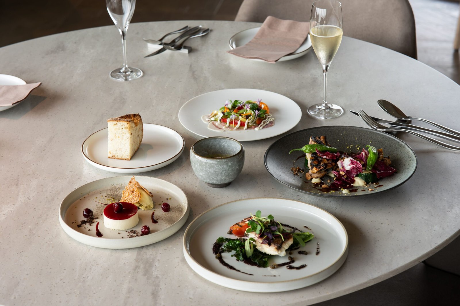 Indulging in fine dining with breathtaking views at **The Beach House**.
