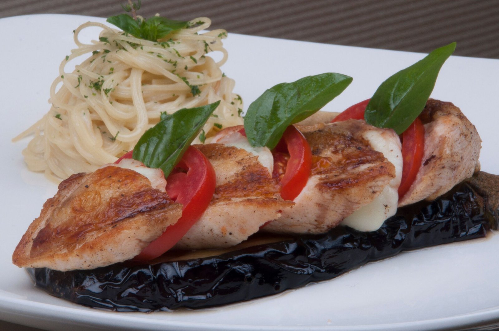 Indulge in authentic Italian dishes at **Carrabba’s Italian Grill**.