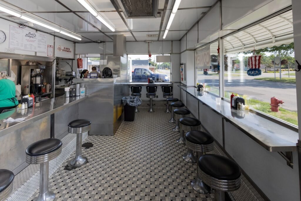 Retro diner interior with checkered floor and stool seating in Livonia, Michigan