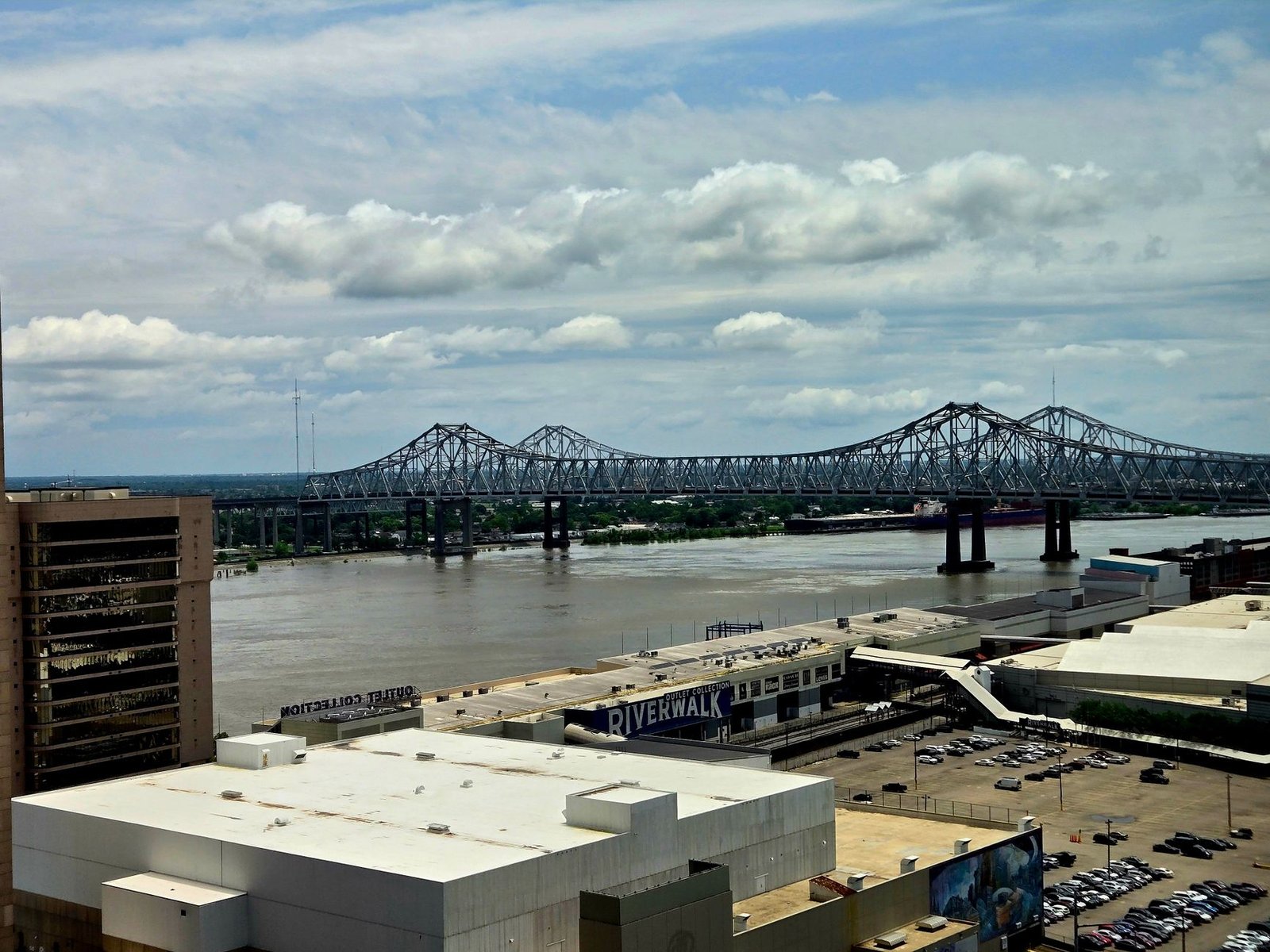 Stunning urban view of Mississippi River bridge from downtown area with cloudy sky